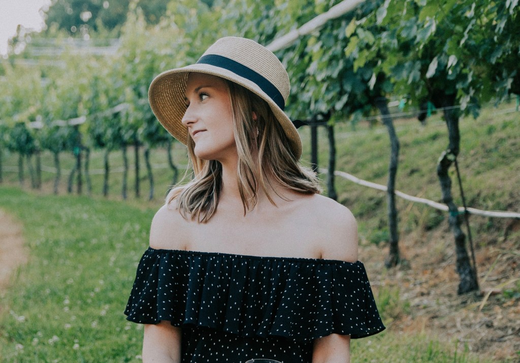 woman with hat in vinyard